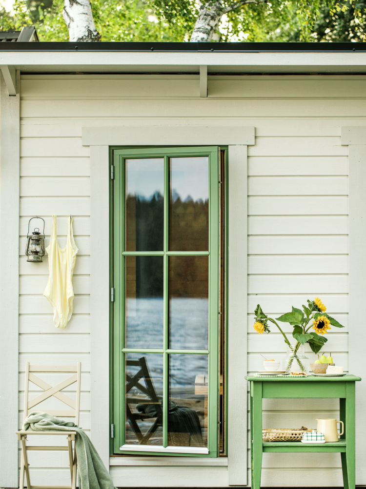 lyst hus grønne detaljer