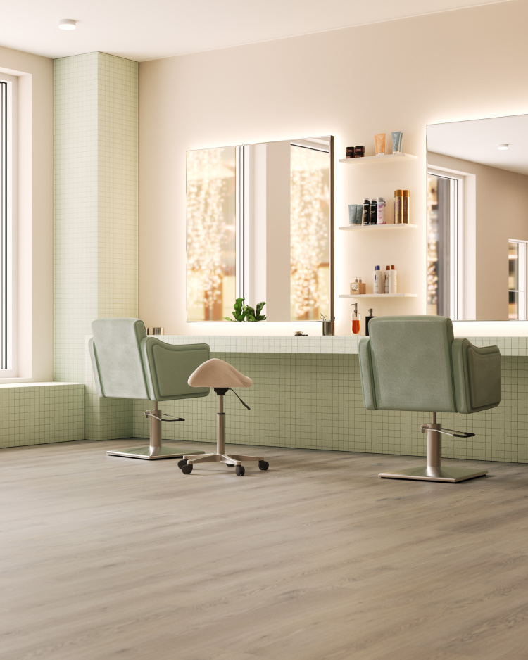 lyst rom, frisersalong med grønne møbler og gråbrunt gulv